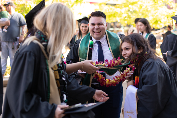 graduates smiling